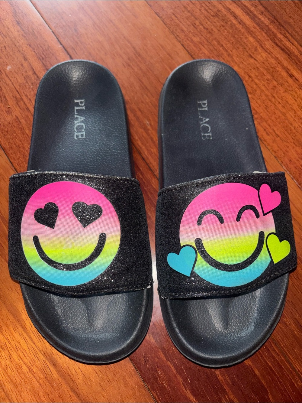 Place Kids' Black Slides with Pink, Yellow & Blue Rainbow Smile Faces